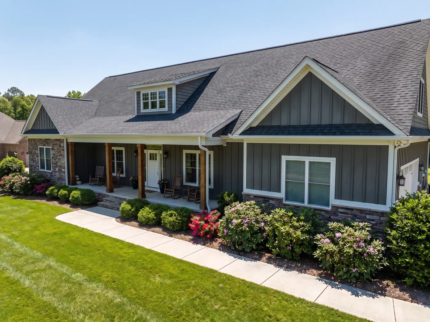 Before and after of an algae-streaked roof replaced with algae-resistant shingles on a Creekside home in Garner, NC